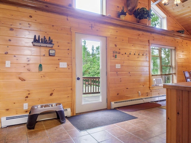 doorway to outside with tile patterned flooring, high vaulted ceiling, wooden walls, and a baseboard heating unit