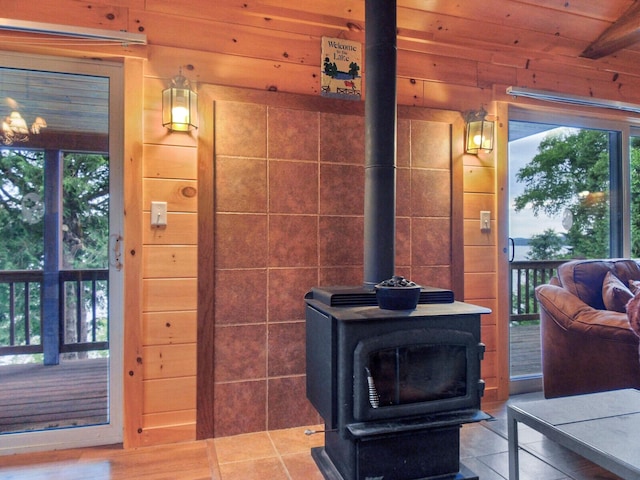 details featuring a wood stove and wood ceiling