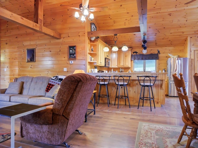 living room featuring wooden ceiling, light hardwood / wood-style flooring, beamed ceiling, high vaulted ceiling, and wood walls