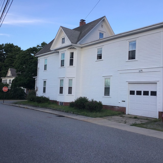 view of side of property featuring a garage