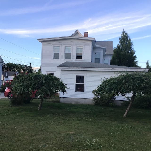 view of home's exterior featuring a yard