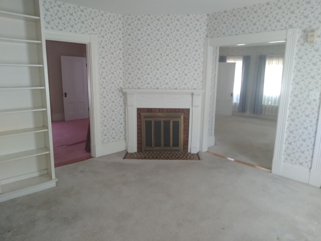 unfurnished living room featuring light colored carpet