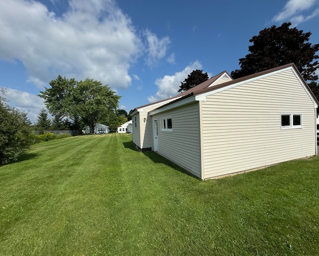 view of home's exterior featuring a yard