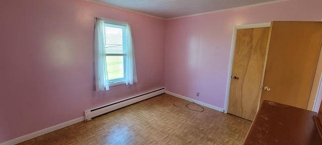 unfurnished room with baseboard heating, ornamental molding, and light parquet floors