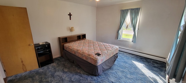 bedroom featuring a baseboard radiator and dark colored carpet