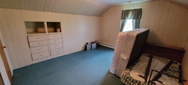 additional living space featuring baseboard heating, lofted ceiling, wood walls, and dark carpet