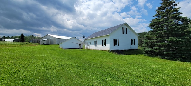 rear view of house with a lawn