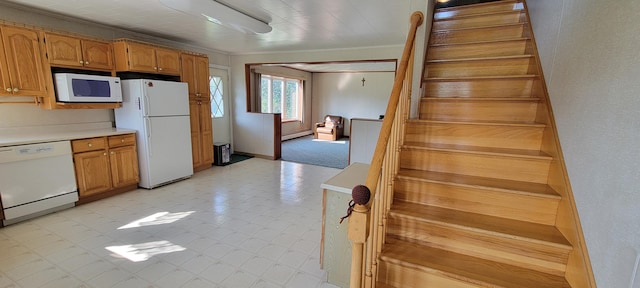 kitchen with baseboard heating, crown molding, and white appliances