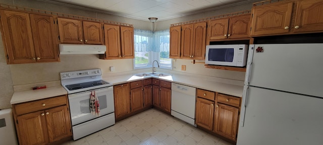 kitchen featuring sink and white appliances