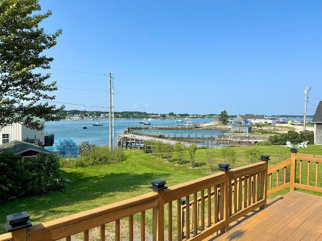 deck featuring a water view and a yard