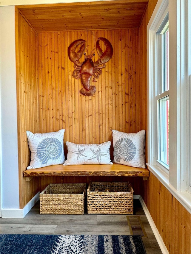 mudroom featuring wooden walls and hardwood / wood-style floors