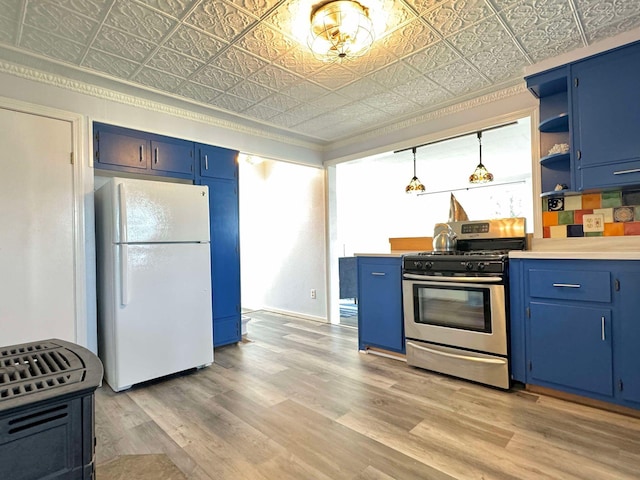 kitchen featuring blue cabinets, white fridge, stainless steel gas range, and light wood-type flooring