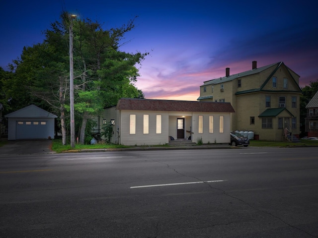 view of front property with a garage and an outdoor structure