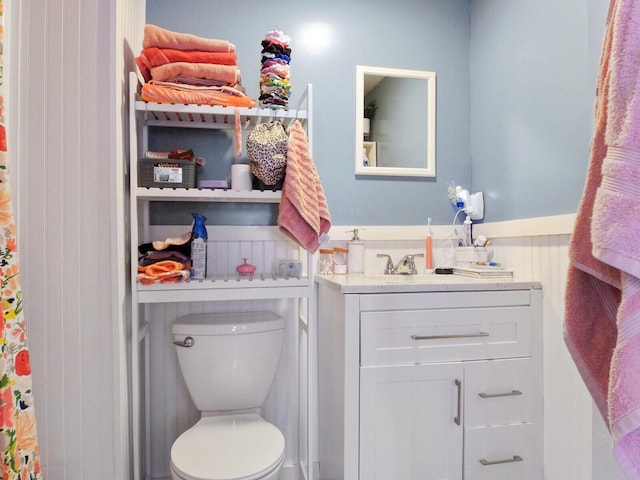 bathroom featuring vanity and toilet