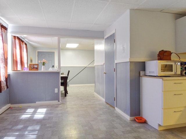 kitchen featuring a paneled ceiling