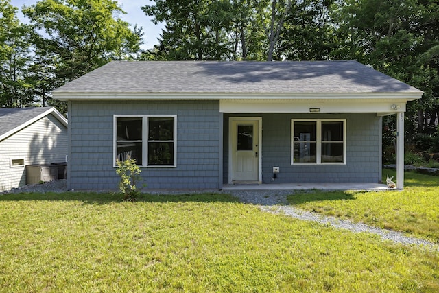 bungalow-style house with a front lawn