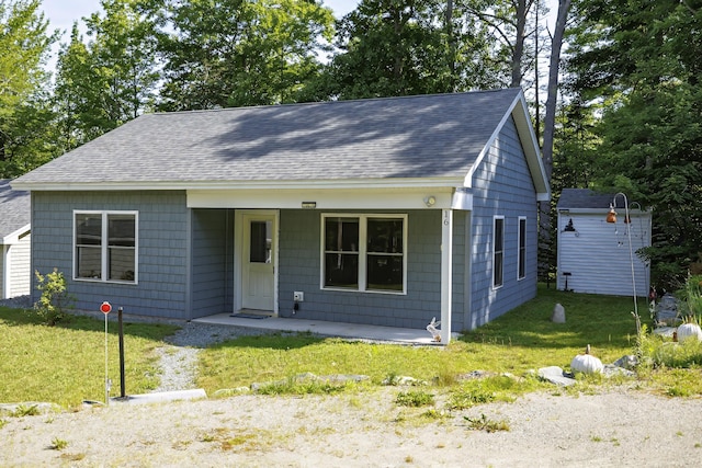 bungalow-style home featuring a front yard and a porch