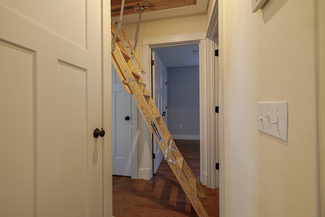 corridor featuring dark hardwood / wood-style flooring