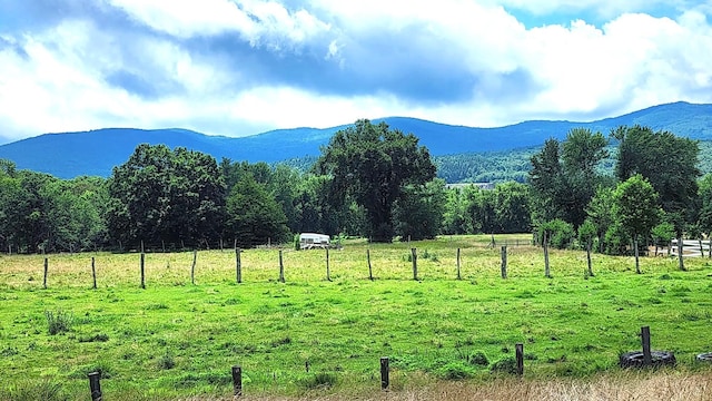 mountain view featuring a rural view