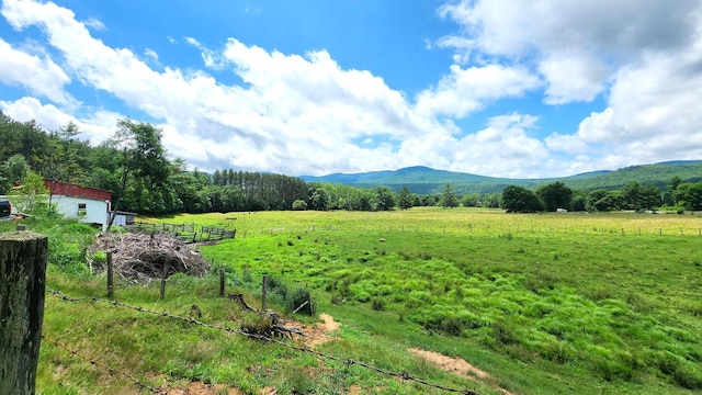 mountain view featuring a rural view