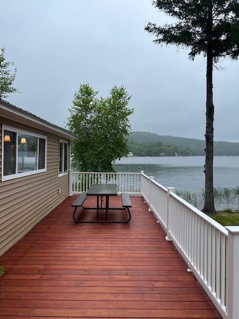 deck featuring a water view