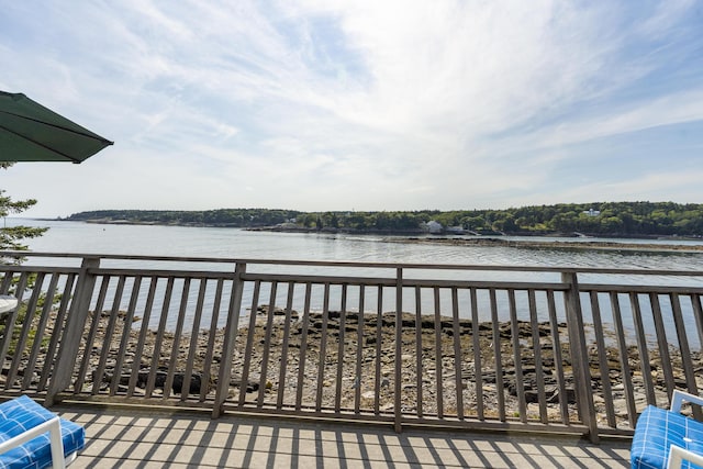 wooden terrace with a water view