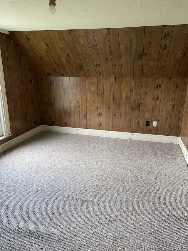 bonus room with wood walls, carpet floors, lofted ceiling, and wood ceiling