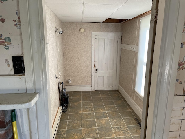 laundry area featuring a baseboard heating unit