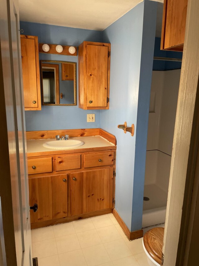 bathroom with a shower and vanity