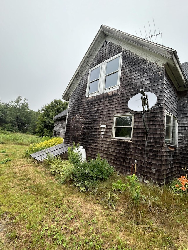 view of home's exterior with a yard