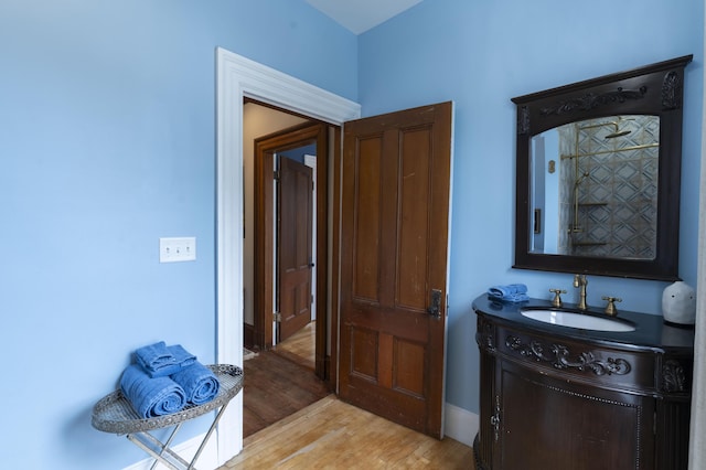 bathroom with wood-type flooring and vanity