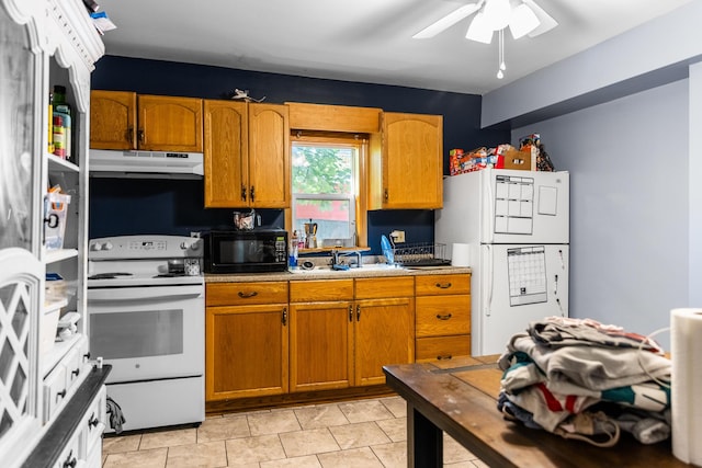 kitchen featuring ceiling fan, light tile patterned floors, sink, and white appliances