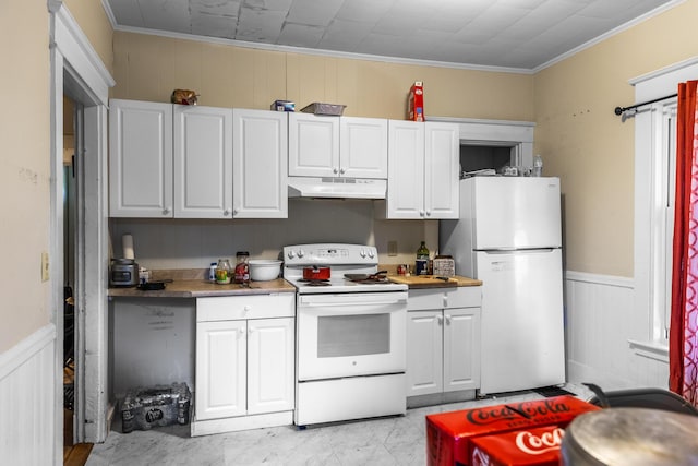 kitchen featuring crown molding, white cabinets, and white appliances