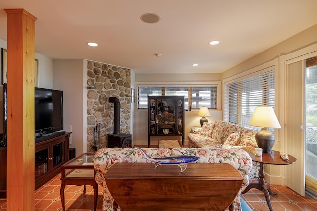 tiled living room with a wood stove