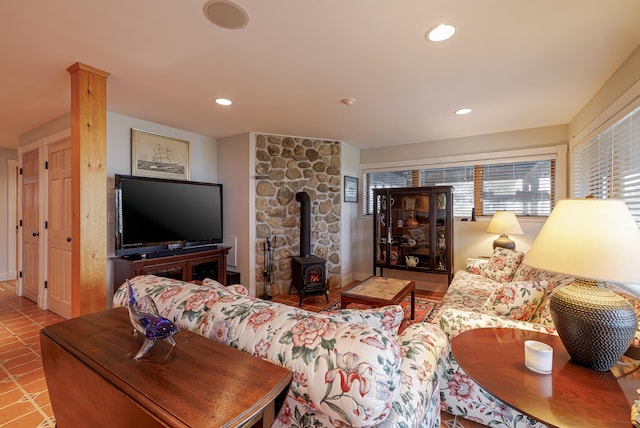 tiled living room with a wood stove