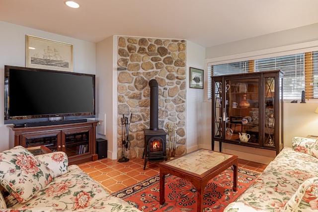 tiled living room with a wood stove