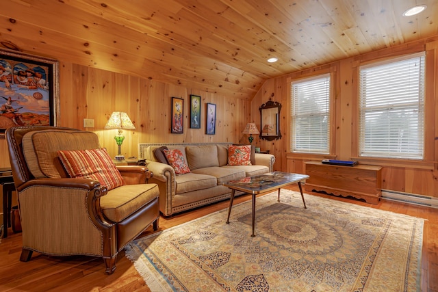 living room featuring lofted ceiling, a baseboard heating unit, wooden walls, light wood-type flooring, and wood ceiling