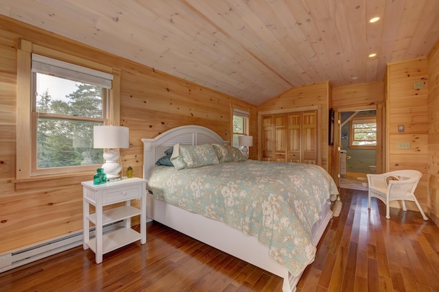 bedroom with wood-type flooring, lofted ceiling, wood walls, and wood ceiling