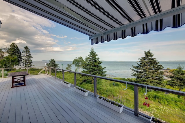 wooden deck featuring a water view