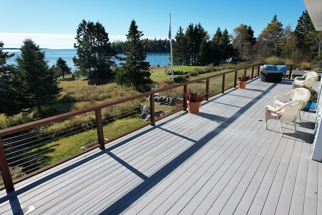 wooden terrace with a water view