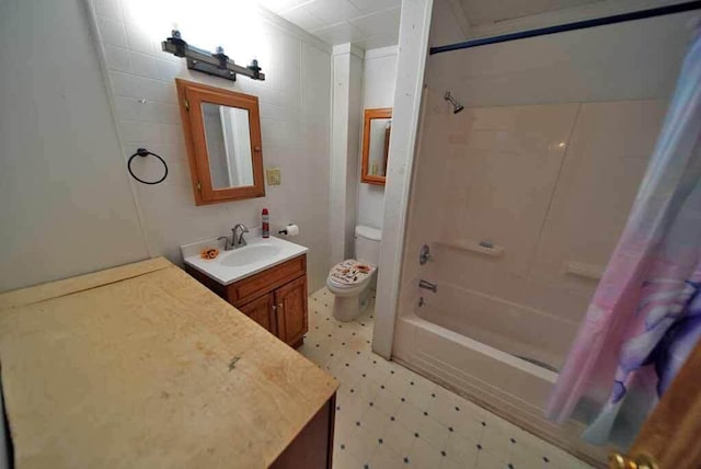 full bathroom featuring toilet, vanity, and shower / bath combo with shower curtain