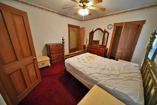 bedroom with ceiling fan, ornamental molding, and dark colored carpet