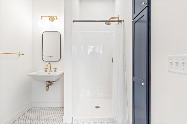 bathroom with sink, tile patterned flooring, and a shower with shower curtain