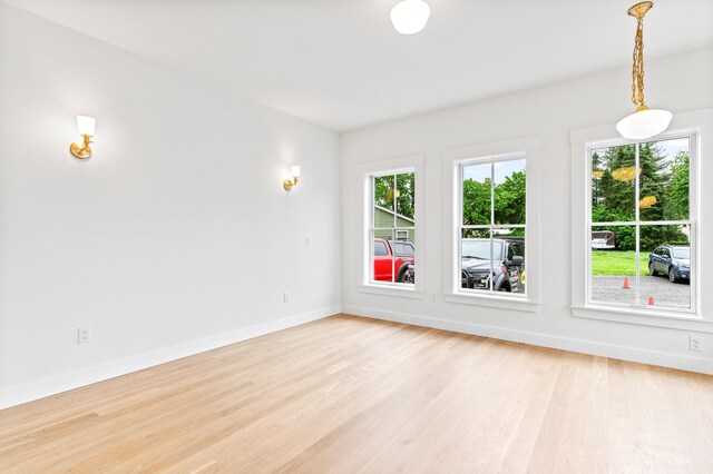 unfurnished room with light hardwood / wood-style flooring