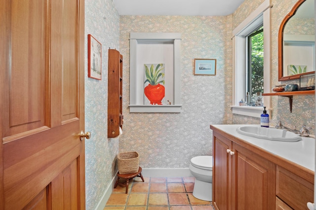 bathroom with tile patterned floors, toilet, and vanity