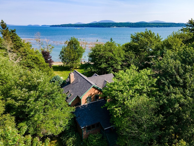 aerial view featuring a water and mountain view