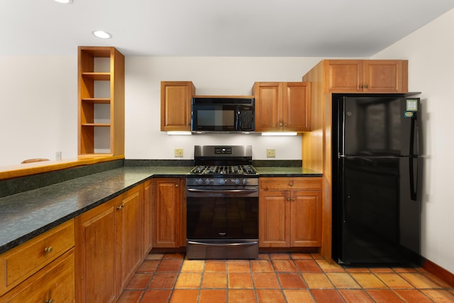 kitchen featuring light tile patterned floors and black appliances