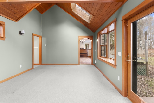 spare room with light carpet, wooden ceiling, and an inviting chandelier