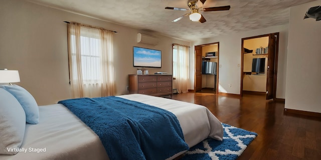 bedroom featuring a textured ceiling, ceiling fan, dark wood-type flooring, and a wall mounted AC