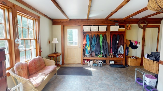 mudroom featuring baseboard heating and plenty of natural light